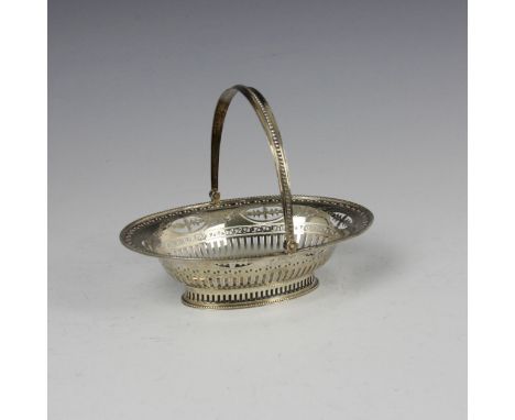 An Edwardian silver swing handled basket, Haseler Brothers, London 1906, the oval shaped basket with beaded border above pier