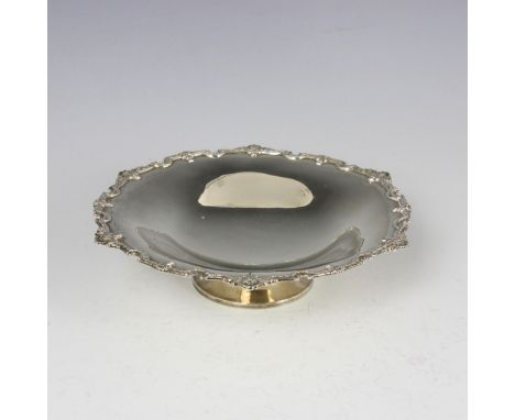 A George V silver pedestal dish, Adie Brothers Ltd, Birmingham 1930, the shell cast shaped rim above plain polished well, upo