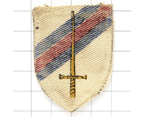 6th Guards Tank Brigade WW2 cloth printed formation sign.White shield bearing upright sword with diagonal bar of Guards colou