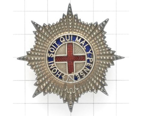 Coldstream Guards Warrant Officer’s cap star.A fine cut silvered example; the Garter pierced with blue enamel ground, central
