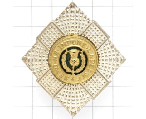 Scottish. Royal Scots Officer’s post war cap badge.Die-cast silvered, gilt and green enamelLoopsVGC