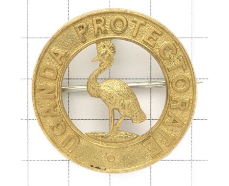 Uganda Protectorate Officer's scarce gilt helmet pagri badge.Fine die-cast rich gilt circlet ‘UGANDA PROTECTORATE’ with crest