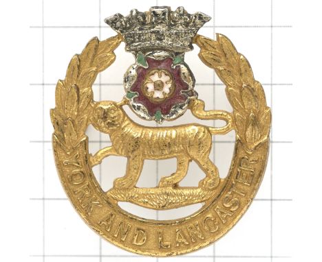 York and Lancaster Regiment Officer’s cap badge.Die-cast gilt with applied silvered coronet with red and green enamel rose. R