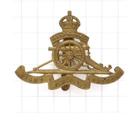 Federation of Malay States Volunteer Force Artillery Light Battery cap badge.Die-stamped brass gun pattern with laurel spray 