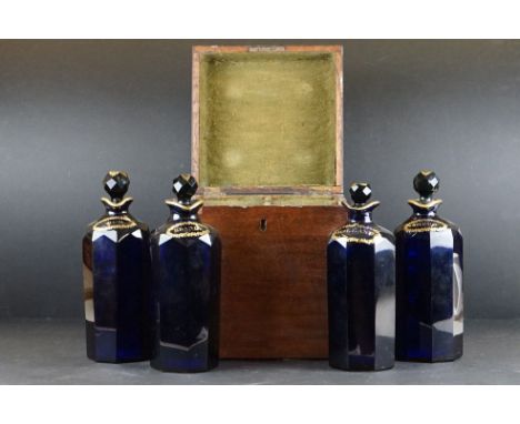 George III Mahogany Square Four Section Decanter Box fitted with Four Bristol Blue Spirit Decanters with Faceted Stoppers, ea