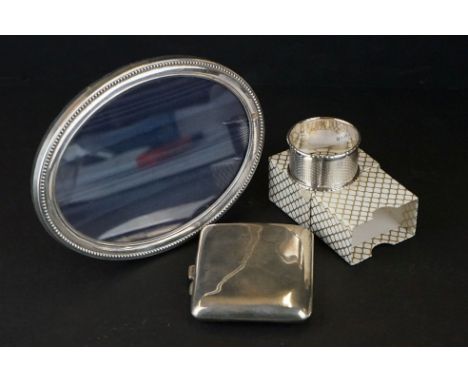 A group of fully hallmarked sterling silver collectables to include a photograph frame, cheroot case and a napkin ring. 