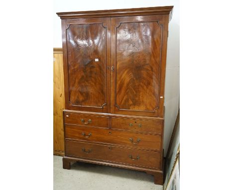 George III Mahogany and Mahogany Veneered Linen Press, the base with an arrangement of four drawers, raised on bracket feet, 