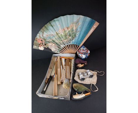 A box of mixed collectables to include a quantity of folding fans, meerschaum pipes and a ceramic sensor. 
