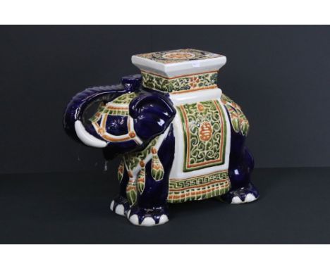 A large ceramic elephant seat / stool, stands approx 41cm in height. 