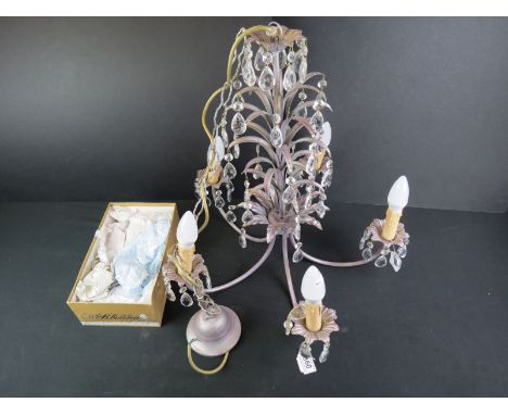A contemporary five branch ceiling light with glass droplets. 