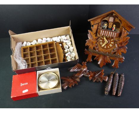 A small group of mixed collectables to include a cuckoo clock, a desk clock and a collection of ceramic thimbles. 