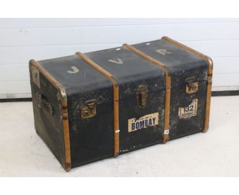 Large Early 20th century Wooden Bound Travelling Trunk with Bombay luggage labels, 91cm wide x 46cm high 