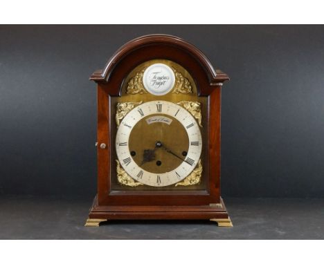 A Comitti of London mantle clock with Roman numeral hour markers, marked 'Tempus Fugit' to the front, latin for time flies. 