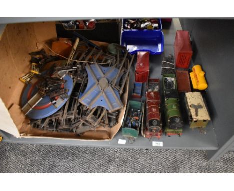 A shelf of 0 gauge including Hornby loco's , Rolling Stock, Accessories, miniature Lead Figures and Track