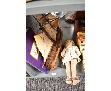 A wooden scale model Sailboat named Abatross along with a felt covered Doll believed to have been made by Nora Wellings circa