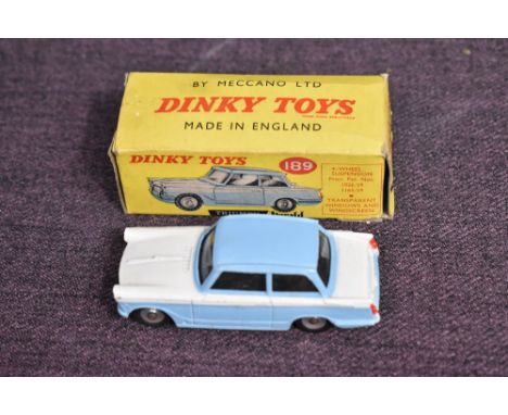 A Dinky diecast, 189 Triumph Herald in light blue and white having 4 wheel suspension, in original light blue spot box