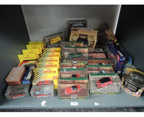 A shelf of modern diecasts including Corgi Classics, Maisto, Shell etc, all boxed approx 40