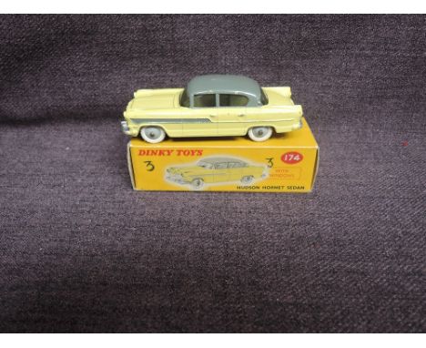 A Dinky diecast, 174 Hudson Hornet Sedan, Yellow &amp; Grey in original correct spot box