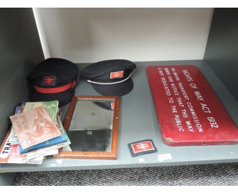 A shelf of Railway related items including Right of Way Act 1932 Enamel Sign, BR Mirror and Caps, ABC and similar Booklets et