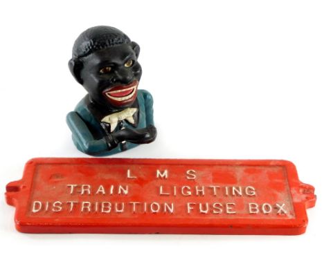 A cast iron plaque, stamped LMS train lighting fuse box, 37cm wide, and a cast iron money box bearing name to underside J E S