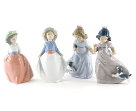 Four Nao porcelain figures, each depicting young children in various poses, one with a puppy, 17cm high.