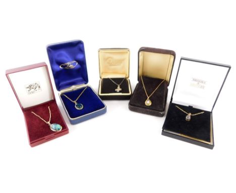 A group of pendants and chains, to include a silver flower pendant set with central garnet stone, two gold plated mother of p