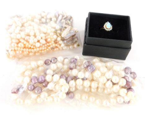 A group of jewellery, to include an imitation opal and silver dress ring, various pearl and faux pearl necklaces, some with 9