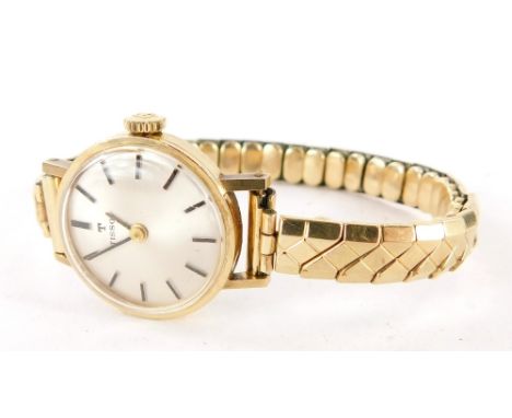 A Tissot ladies wristwatch, with silvered coloured dial, in a yellow metal case unmarked bearing the inscription R M Stockwel