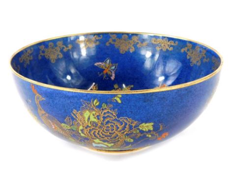 A Carltonware bowl, with gilt border and decoration, decorated with peacock and flowers with blue Carltonware stamp to unders