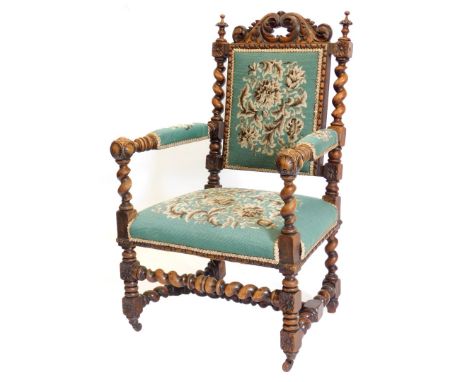 A late 19thC carved walnut open armchair or throne, decorated overall with scrolls, spiral turning, egg and dart borders etc,