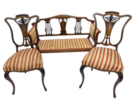 An Edwardian mahogany and marquetry salon sofa, with two pierced splats flanking a central inlaid splat, decorated with putti