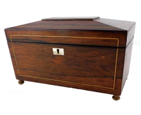 A 19thC rosewood and boxwood strung tea caddy, the hinged lid enclosing a fitted interior on bun feet, 30cm wide.