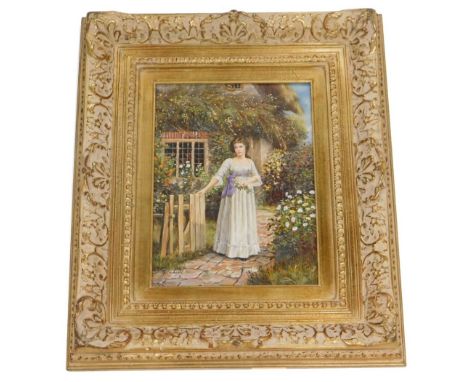 G. Larkin. Lady in front of a thatched cottage beside a gate, oil on board, 39cm x 29cm.