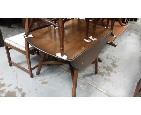 Ercol drop leaf table, set of four Ercol ladder back chairs and a glazed bookcase