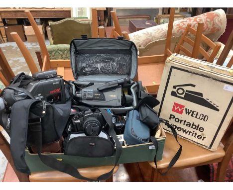 Quantity of video cameras and accessories, typewriter and box of badges and key rings