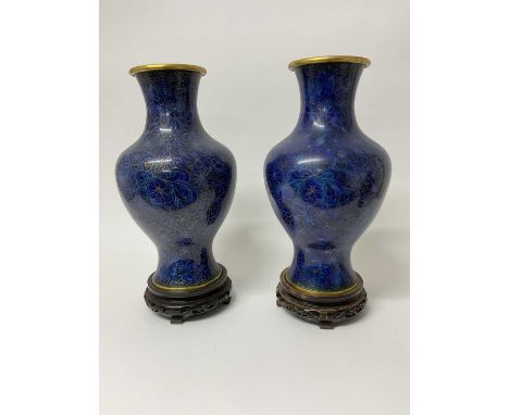Large pair of Chinese cloisonné blue enamel vases on carved wooden stands, 44cm high.