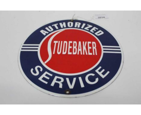 Reproduction circular Studebaker Authorized Service enamel sign, 21.5cm in diameter.