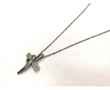 9ct white gold diamond set stylised cross pendant on silver chain, 45.5cm long9ct pendant weighs 1.9 grams