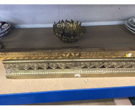 Two part fenders, one with a scrollwork pattern and the other with Greek Key and Pinecone pattern, together with an ormolu li