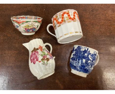 Lowestoft polychrome cream jug, Worcester 'Dragons in Compartments' tea bowl, and two English coffee cups (4)Lowestoft jug- s