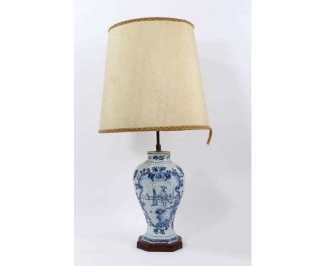 18th century Dutch delft vase, of facetted baluster form, decorated in blue and white with figural reserve, the vase 30cm hig