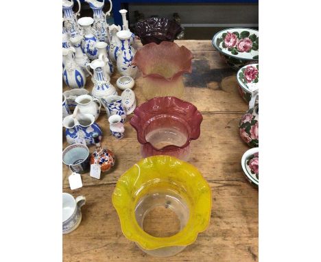 Four Edwardian frosted and tinted glass oil lamp shadesSome fleabites around the bottom rims but otherwise in good condition.
