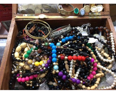 Wooden box containing two gold pendants and chain, quantity of bead necklaces, wristwatches and other costume jewelleryTwo go