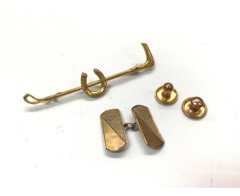 9ct gold riding crop brooch, two 9ct gold studs and one 9ct gold cufflinkTotal weight 6.7 grams 