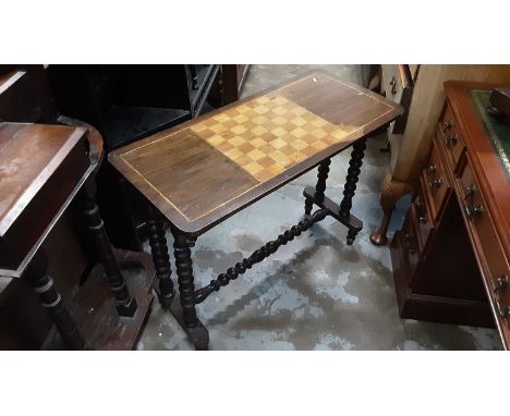 19th century mahogany stretcher table with chessboard top on bobbin turned supports, 86cm wide, 40cm deep, 66.5cm high