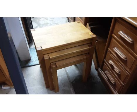 Contemporary light oak nest of three tables, matching coffee table and a small bookcase (3)