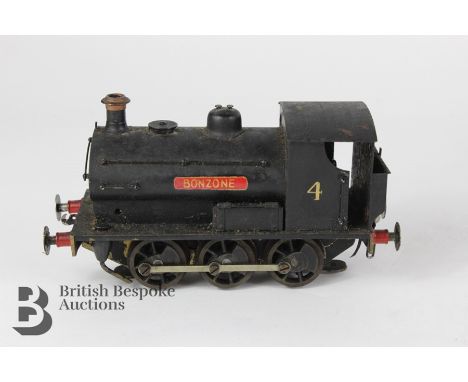 Vintage Bonzone saddle tank locomotive nr 4, painted in black with red highlights, three rail electric, approx 15.5 cms in le