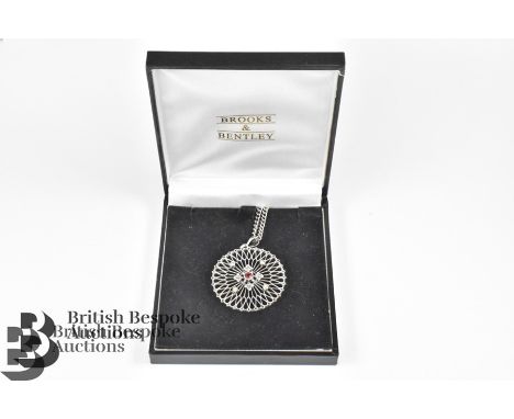 William Hair Haseler Arts and Crafts silver, garnet and pearl filigree pendant, approx 30 mm d, suspended from a silver chain