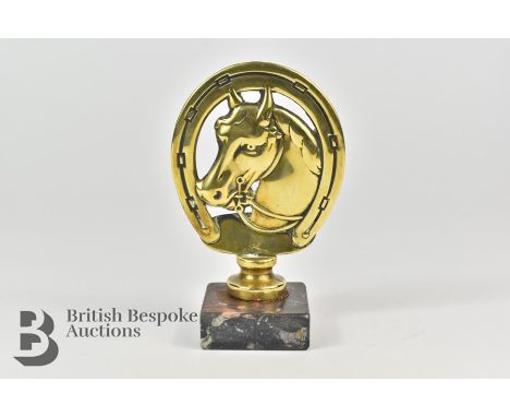 Unusual brass equestrian car mascot, featuring racehorse framed in a horseshoe, stamped AEL (Lejeune Motor Mascot Ltd) to the