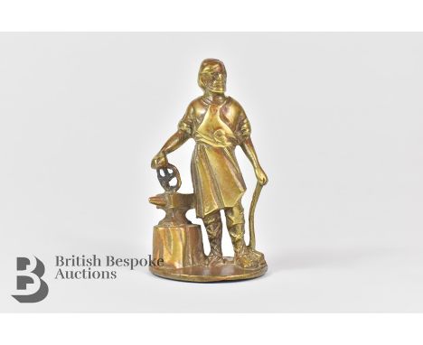 Vulcan 'Blacksmith' brass blacksmith working by his anvil mascot, for Edwardian vintage motor cars and lorries.&nbsp;